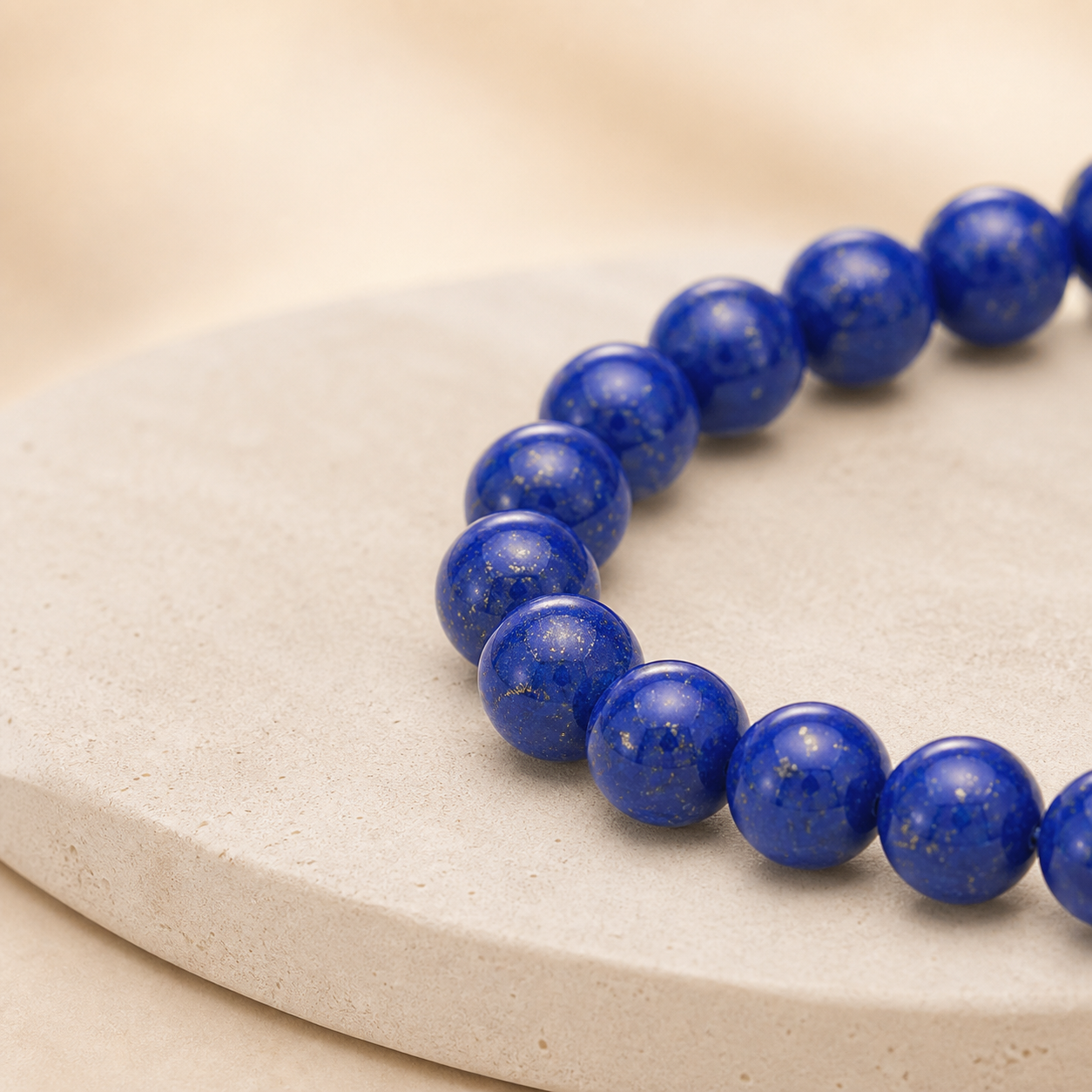 Close detail of uniform royal blue lapis lazuli beads with fine golden pyrite flecks